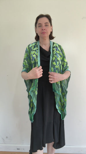 modeling  devoré or burnout velvet kimono jacket that is hand painted Gingko Leaves. 