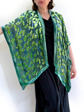 Load image into Gallery viewer, modeling green gingko leaf devoré or burnout velvet kimono jacket that is hand painted. Worn over back dress.
