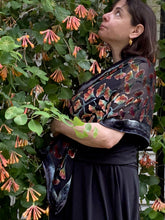 Load image into Gallery viewer, woman on orange flowers burnout velvet scarf looking tab flowers
