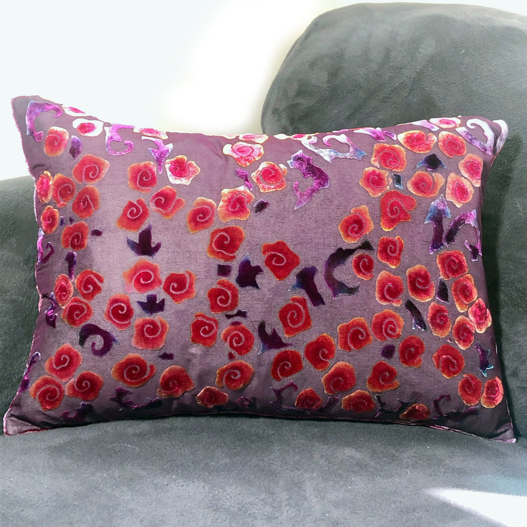 rectangular burnout silk velvet pillow with red orange hand panted roses on purple  background