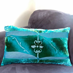 Teal  hand painted burnout velvet Pillow Inspired by Architectural Details with fleur de lis center on gray couch